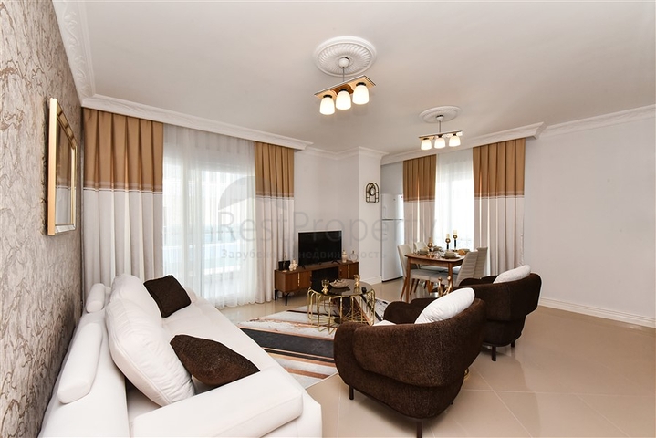 Красивая квартира в резиденции у моря в районе Махмутлар.