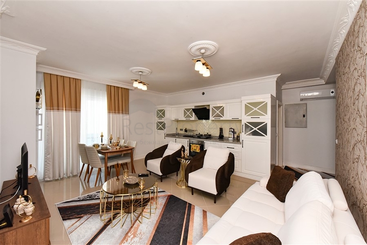 Красивая квартира в резиденции у моря в районе Махмутлар.