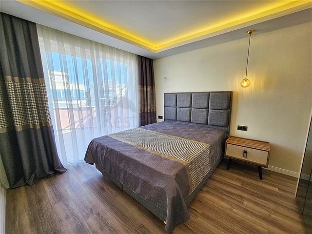 Просторная квартира 4+1 с современным дизайном в районе Махмутлар