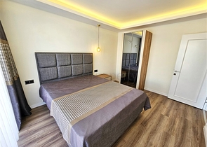 Просторная квартира 4+1 с современным дизайном в районе Махмутлар