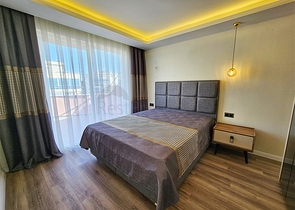 Просторная квартира 4+1 с современным дизайном в районе Махмутлар