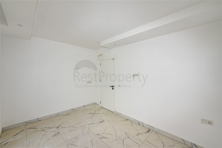 Квартира 1+1 с видом на горы и море в районе Махмутлар