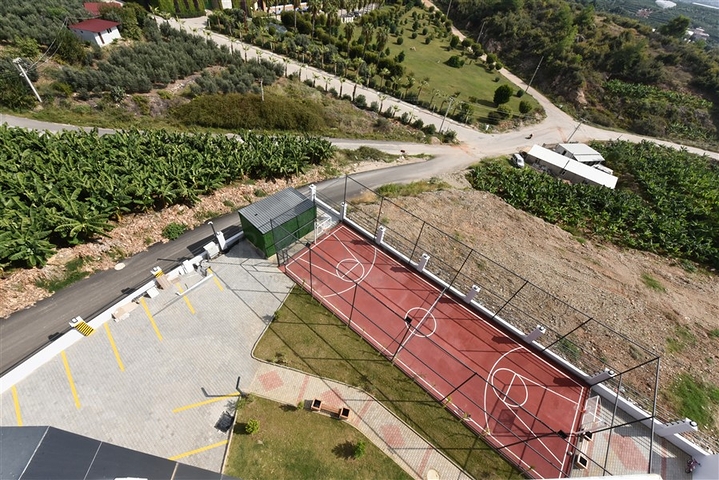 Квартира 1+1 с видом на горы и море в районе Махмутлар