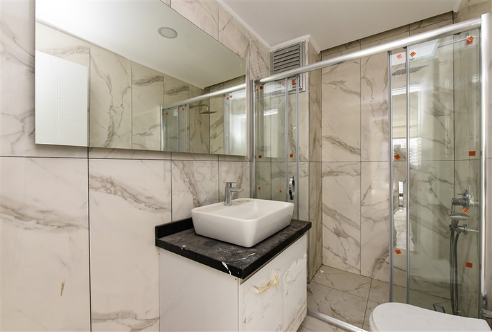 Квартира 1+1 с видом на горы и море в районе Махмутлар