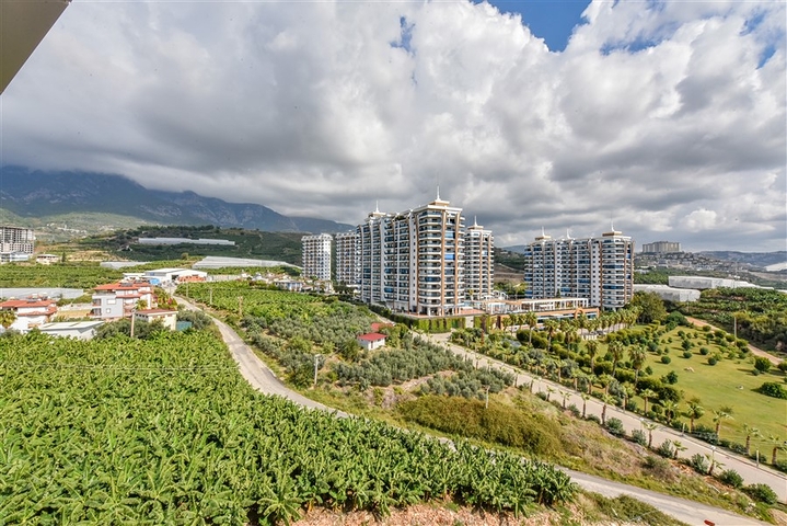 Квартира 1+1 с видом на горы и море в районе Махмутлар