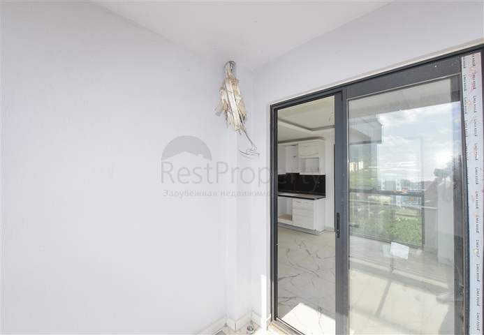 Квартира 1+1 с видом на горы и море в районе Махмутлар