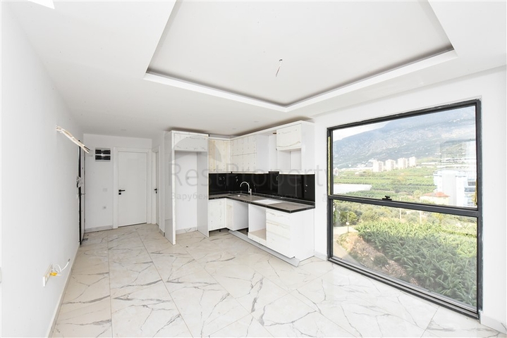 Квартира 1+1 с видом на горы и море в районе Махмутлар