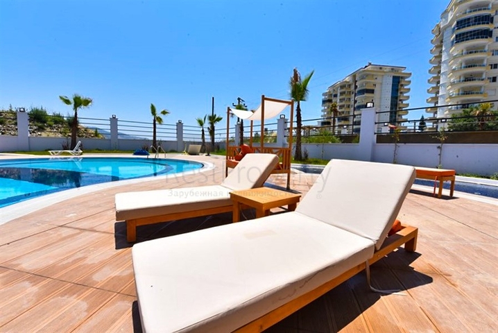 Квартира 1+1 с видом на горы и море в районе Махмутлар