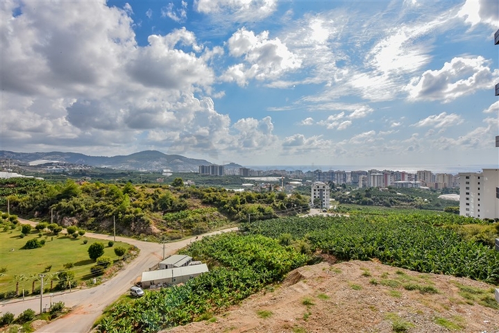 Квартира 1+1 с видом на горы и море в районе Махмутлар