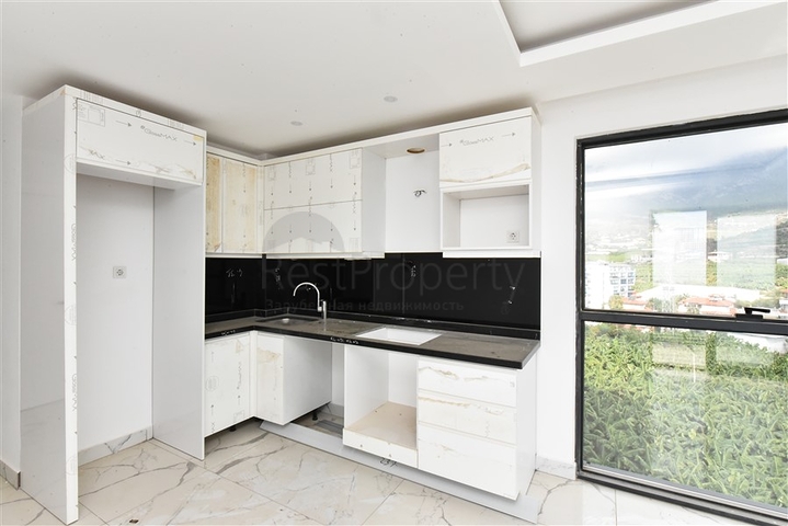 Квартира 1+1 с видом на горы и море в районе Махмутлар