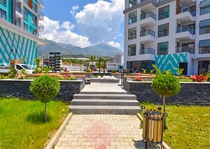 Квартира 1+1 с видом на горы и море в районе Махмутлар