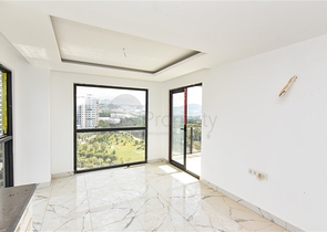 Квартира 1+1 с видом на горы и море в районе Махмутлар