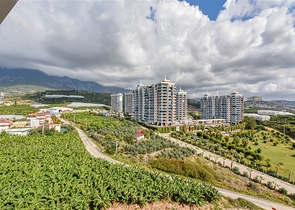 Квартира 1+1 с видом на горы и море в районе Махмутлар