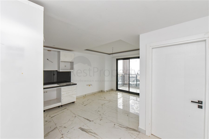 Квартира 1+1 в новом доме в районе Махмутлар