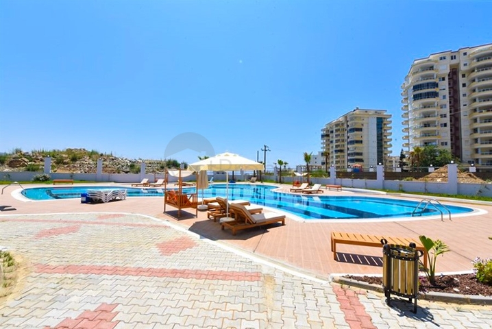 Квартира 1+1 в новом доме в районе Махмутлар