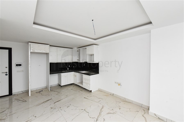 Квартира 1+1 в новом доме в районе Махмутлар