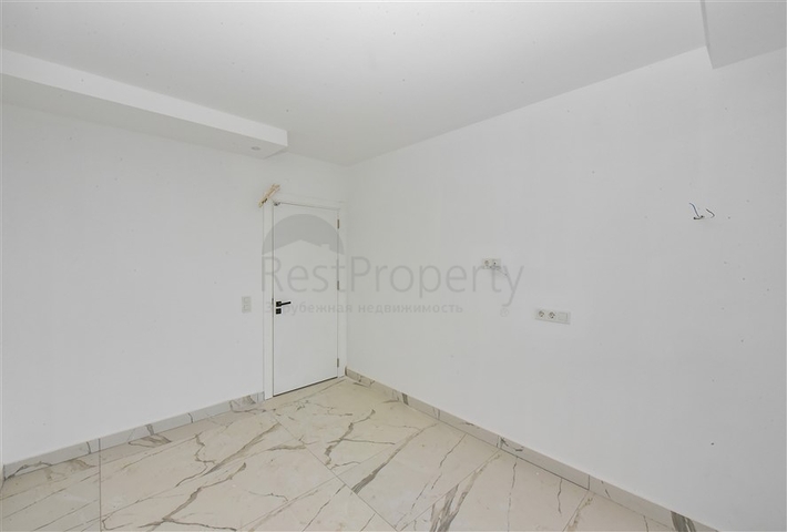 Квартира 1+1 в новом доме в районе Махмутлар