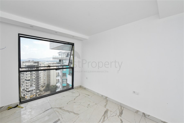 Квартира 1+1 в новом доме в районе Махмутлар