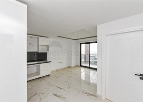 Квартира 1+1 в новом доме в районе Махмутлар