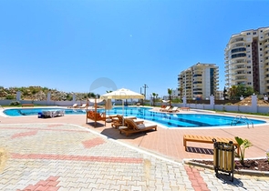 Квартира 1+1 в новом доме в районе Махмутлар