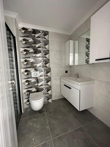 Квартира планировкой 1+1 в районе Махмутлар