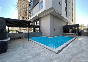 Квартира планировкой 1+1 в районе Махмутлар