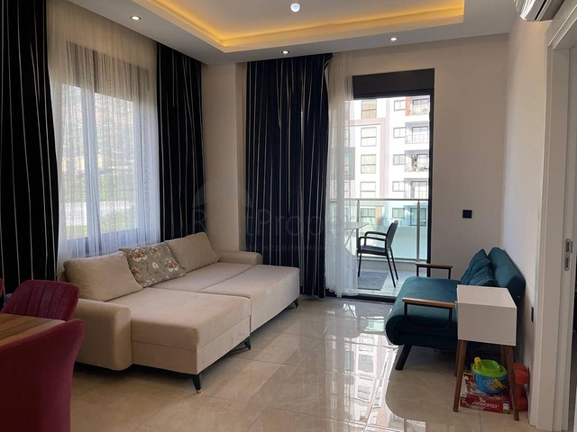 Двухкомнатная квартира в районе Махмутлар