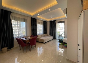 Двухкомнатная квартира в районе Махмутлар