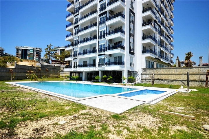 Двухкомнатная квартира в новом доме в районе Авсаллар