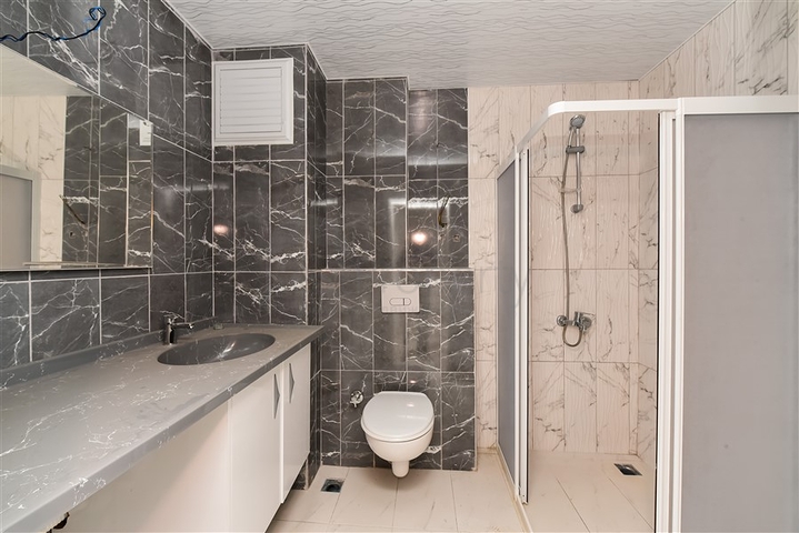 Двухкомнатная квартира в новом доме в районе Авсаллар