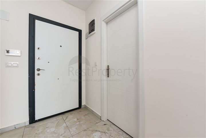 Двухкомнатная квартира в новом доме в районе Авсаллар