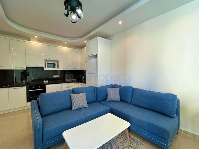 Квартира 1+1 в районе Махмутлар с мебелью и техникой. 