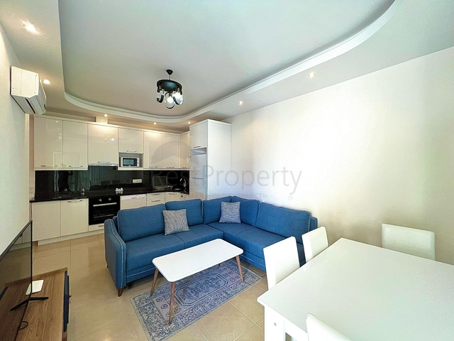 Квартира 1+1 в районе Махмутлар с мебелью и техникой. 