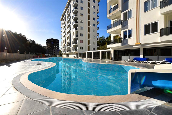 Квартира 1+1 в новом комплексе в окружении хвойного леса