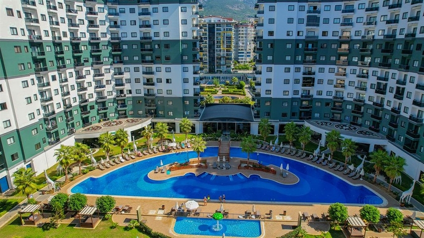 Квартира 1+1 в популярном жилом комплексе в районе Махмутлар