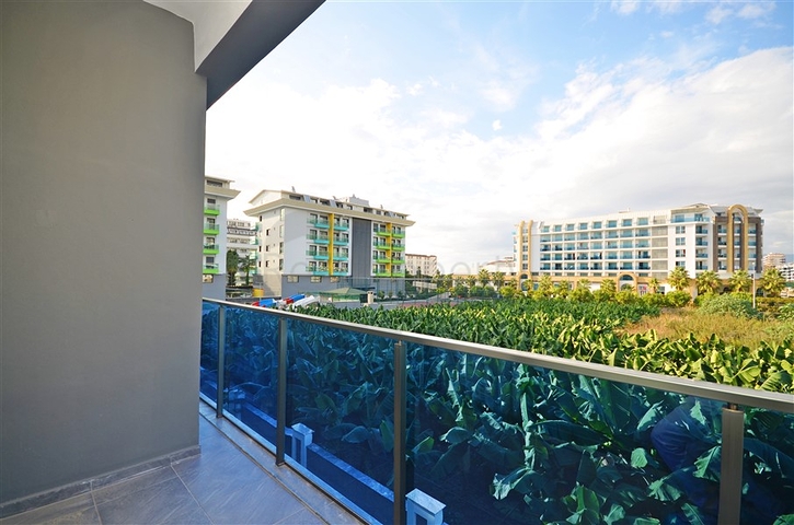 Двухкомнатная квартира в живописном районе Алании и пешей доступности к морю