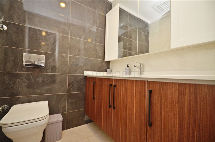 Двухкомнатная квартира в живописном районе Алании и пешей доступности к морю