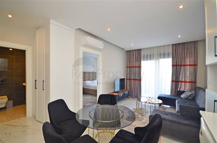 Двухкомнатная квартира в живописном районе Алании и пешей доступности к морю