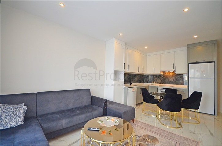 Двухкомнатная квартира в живописном районе Алании и пешей доступности к морю