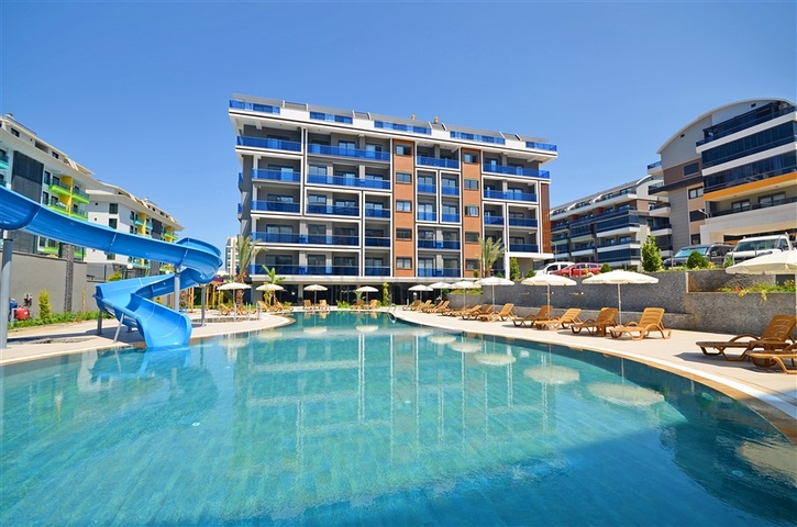 Двухкомнатная квартира в живописном районе Алании и пешей доступности к морю