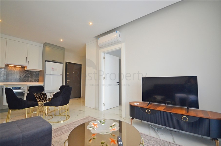 Двухкомнатная квартира в живописном районе Алании и пешей доступности к морю