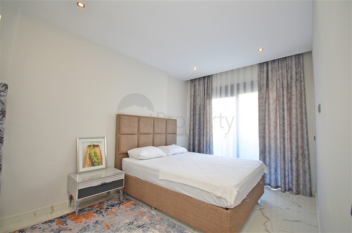 Двухкомнатная квартира в живописном районе Алании и пешей доступности к морю