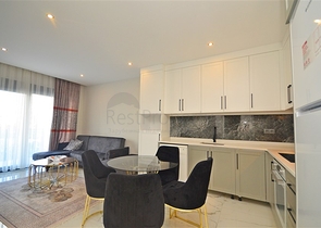 Двухкомнатная квартира в живописном районе Алании и пешей доступности к морю