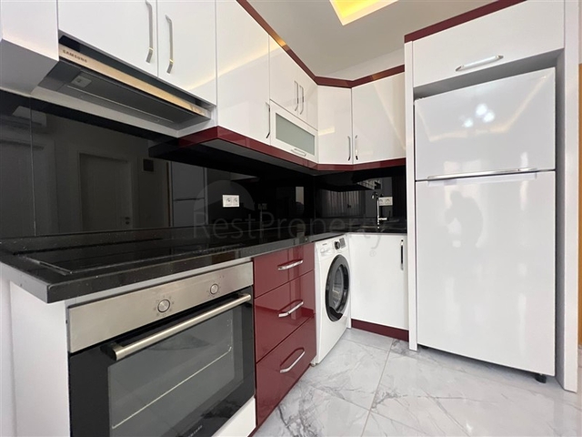 Новая стильная квартира планировкой 1+1 а районе Махмутлар