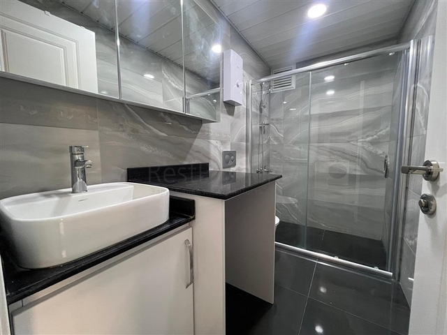 Новая стильная квартира планировкой 1+1 а районе Махмутлар