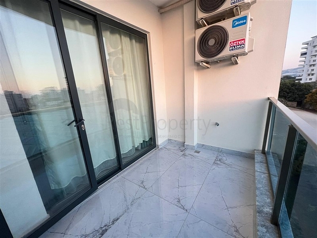 Новая стильная квартира планировкой 1+1 а районе Махмутлар