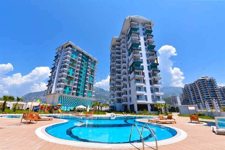 Квартира 1+1 с видом на горы и море в районе Махмутлар