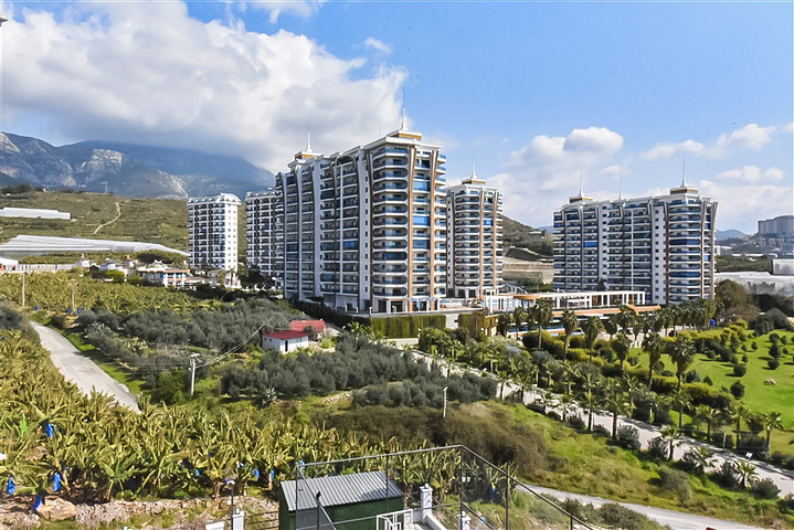 Квартира 1+1 с видом на горы и море в районе Махмутлар