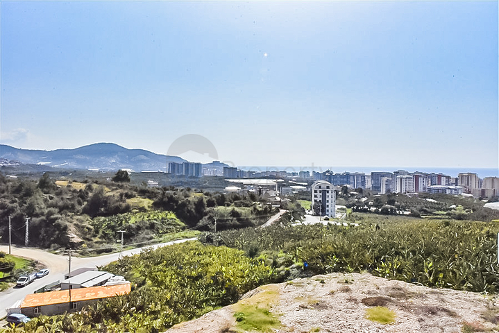 Квартира 1+1 с видом на горы и море в районе Махмутлар