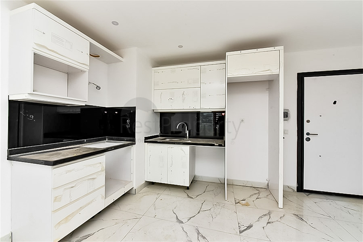 Квартира 1+1 с видом на горы и море в районе Махмутлар